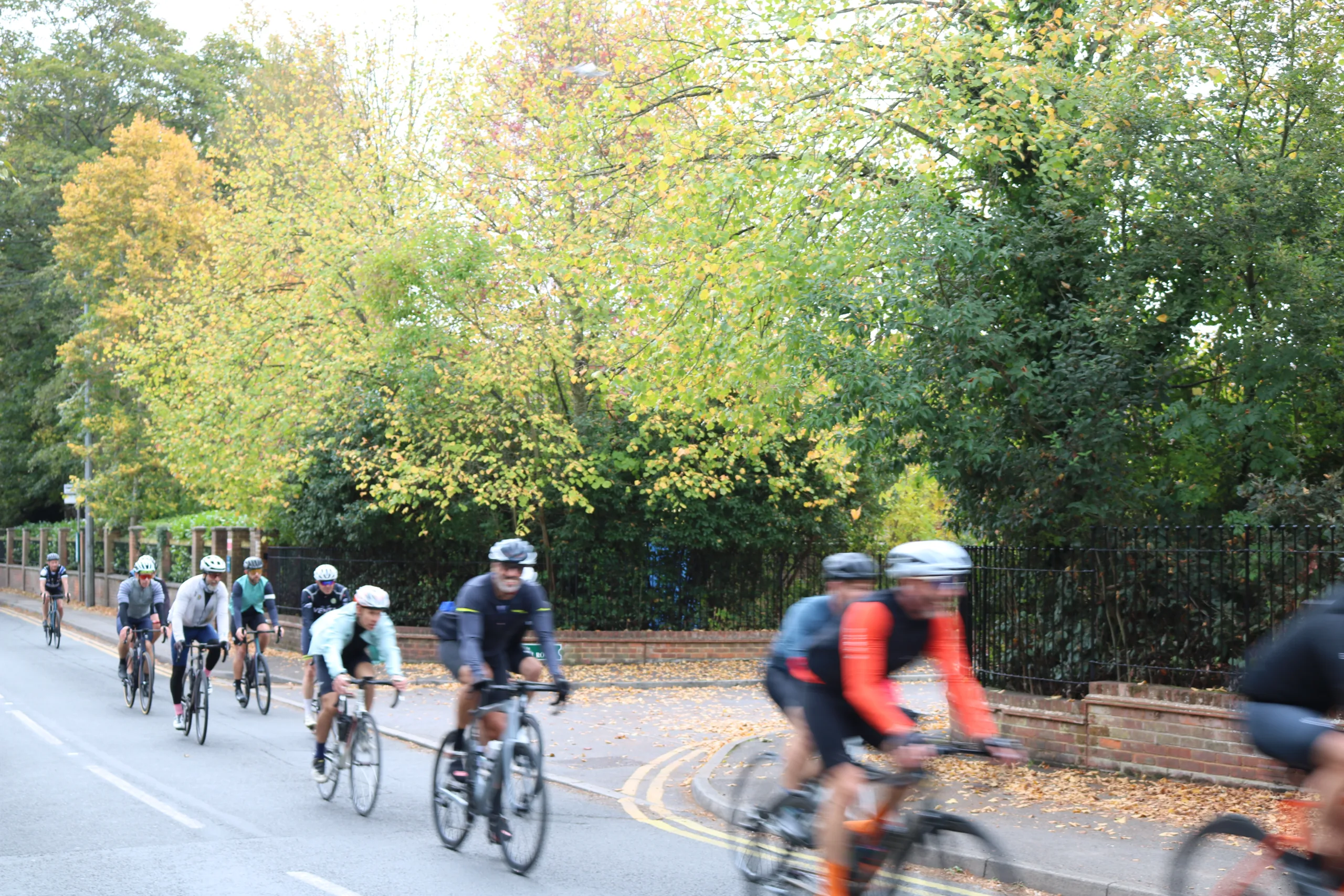 Cyclists riding on the road in Autumn.